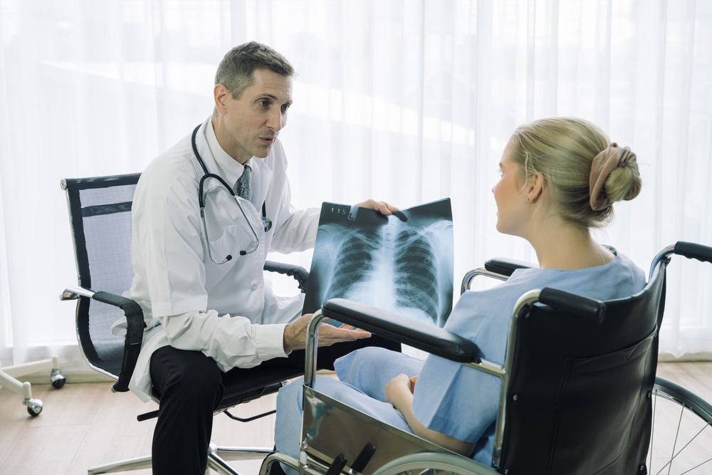 Doctor show and discussing with patient about x-ray