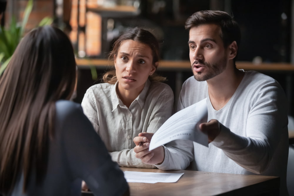 Couple discusses their case with their lawyer